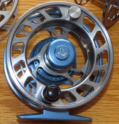 A pair of Shakespeare Beaulite trout fly reels with line and spare spools.